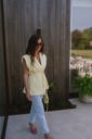 Pastel yellow vest button strap